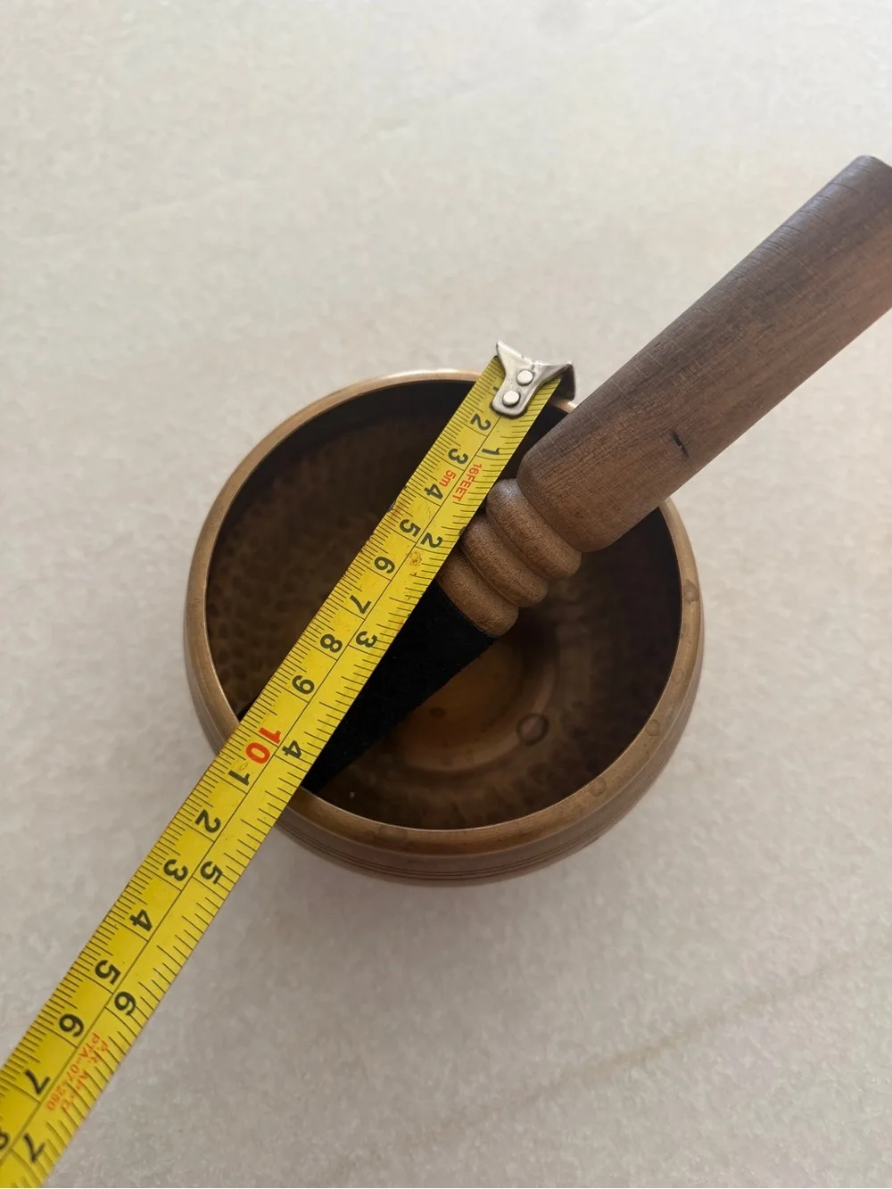 Vintage Brass Singing Bowl with Wooden Mallet on Gold-Patterned Cushion - Picture 5 of 6